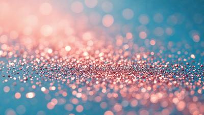 The primary subject of the image is a close-up of a pink and purple glittery surface, which appears to be a pattern or texture. The setting is a blue background, which contrasts with the pink and purple glittery surface. The visual style is a close-up of the glittery surface, showcasing its intricate details. The colors and mood of the image are predominantly pink and purple, creating a vibrant and lively atmosphere.