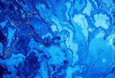 The primary subject of the image is a blue and white swirling pattern, which appears to be a painting or a digital artwork. The setting is a blue background, which complements the swirling pattern. The visual style is a mix of artistic and digital elements, creating a unique and captivating visual experience. The dominant colors are blue and white, with the blue background providing a sense of depth and contrast to the swirling pattern. Overall, the image evokes a sense of movement, creativity, and art