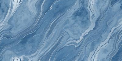 The primary subject of the image is a blue and white marbled tile. The setting is a bathroom, as indicated by the presence of the marbled tile. The visual style is a close-up of the tile, showcasing its intricate design. The dominant colors are blue and white, creating a calm and soothing atmosphere.