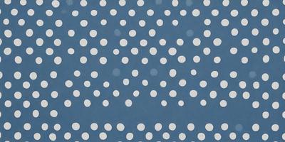 The primary subject of the image is a pattern of white dots on a blue background. The setting is a large, open space with no visible objects or people. The visual style is a close-up of the dots, creating a sense of depth and detail. The colors and mood are predominantly blue and white, giving the image a calm and serene atmosphere.