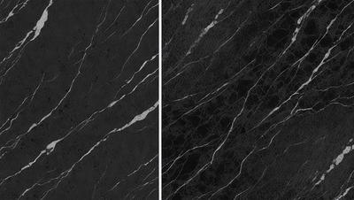 The primary subject of the image is a close-up of a marble countertop. The setting is a kitchen, with the countertop being the main focus of the scene. The visual style is a black and white photo, which adds a classic and timeless feel to the image. The dominant colors are black and white, creating a stark and elegant atmosphere.