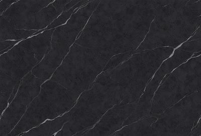 The primary subject of the image is a black marble countertop. The setting is a kitchen, with the countertop being the main focus of the scene. The visual style is a close-up of the marble countertop, showcasing its texture and pattern. The colors and mood of the image are predominantly dark, with the black marble providing a striking contrast against the darker background.