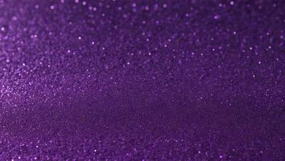 Purple glittery background with purple glittery stars.