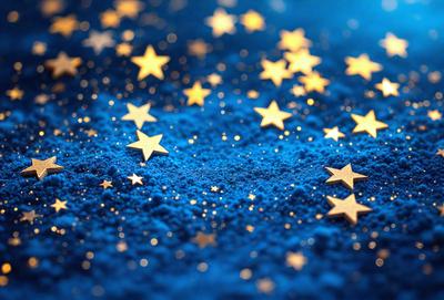 The primary subject of the image is a blue background with a pattern of stars. The setting appears to be a night sky, and the visual style is a combination of a photo and digital art. The dominant colors are blue and gold, creating a serene and peaceful atmosphere.