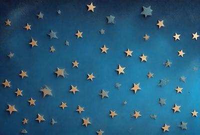 The primary subject of the image is a blue starry background with a pattern of stars. The setting is a dark blue wall, and the visual style is a combination of a photo and digital art. The dominant colors are blue and white, creating a calm and serene atmosphere.