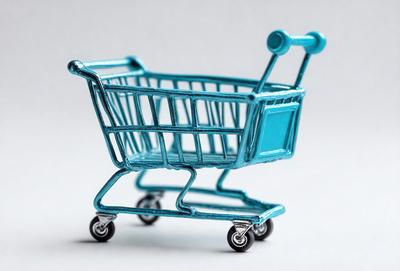 The primary subject of the image is a blue plastic shopping cart. The cart is positioned on a white surface, which serves as the background. The visual style of the image is a combination of photo and digital art, as it appears to be a close-up of the cart with a slightly blurred background. The dominant colors in the image are blue and white, creating a clean and modern atmosphere.