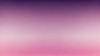 The primary subject of the image is a pink sky, which creates a serene and calming atmosphere. The setting is a vast, open space with no visible landmarks or objects, giving the impression of a vast, empty expanse. The visual style of the image is a combination of photo and digital art, as it appears to be a photo of a digital art piece. The colors and mood of the image are predominantly pink, which adds to the overall sense of tranquility and beauty.
