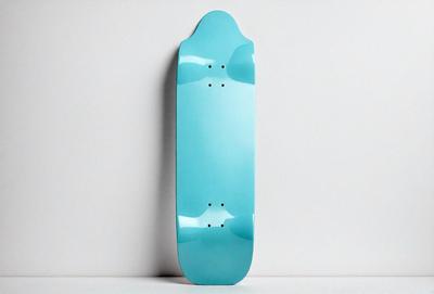 The primary subject of the image is a blue skateboard. The setting is a white wall, and the visual style is a photo. The dominant colors are blue and white, creating a clean and modern atmosphere.