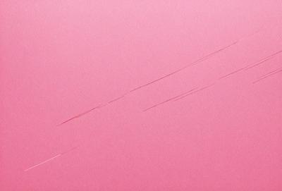 The primary subject of the image is a pink surface with a white line on it. The setting is a pink background, and the visual style appears to be a photo. The colors and mood of the image are predominantly pink, creating a warm and inviting atmosphere.