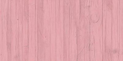 The primary subject of the image is a pink wooden floor. The setting is a room with a pink wall, and the visual style is a close-up of the wooden floor. The colors and mood of the image are predominantly pink, creating a warm and inviting atmosphere.