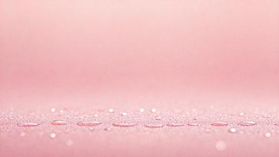 The primary subject of the image is a close-up of a pink surface, possibly a table or a wall. The setting is a room with a pink background, and the visual style appears to be a photo. The colors and mood of the image are predominantly pink, creating a warm and inviting atmosphere.