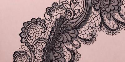 The primary subject of the image is a black and white lace pattern. The setting is a pink background, which contrasts with the lace pattern. The visual style is a combination of a drawing and a pattern, creating a unique and intricate design. The colors and mood of the image are predominantly black and white, giving it a classic and elegant appearance.