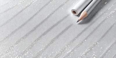 The primary subject of the image is a pencil and a piece of paper. The setting is a table, and the visual style is a close-up of the pencil and paper. The colors and mood of the image are predominantly white, giving it a clean and minimalist appearance.