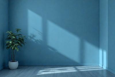 The primary subject of the image is a potted plant, which is placed on a wooden floor. The setting is a room with a blue wall, and the visual style appears to be a photo. The colors in the image are predominantly blue, creating a calm and serene atmosphere.