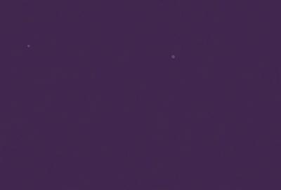 The image is a purple night sky with a single star visible in the distance. The star is located towards the right side of the image. The sky appears to be dark and void of any other celestial objects. The overall atmosphere of the image is serene and peaceful.