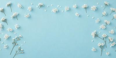 The primary subject of the image is a blue wall with white flowers scattered across it. The setting is a room with a blue background, and the visual style is a photo. The dominant colors are blue and white, creating a calm and serene atmosphere.