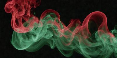 The primary subject of the image is a green and red smoke, which appears to be a digital art or illustration. The smoke is swirling and flowing, creating a dynamic and visually appealing scene. The setting is a dark background, which contrasts with the vibrant colors of the smoke. The visual style of the image is artistic and creative, showcasing the artist's skill in capturing the movement and beauty of the smoke. The colors and mood of the image are lively and energet