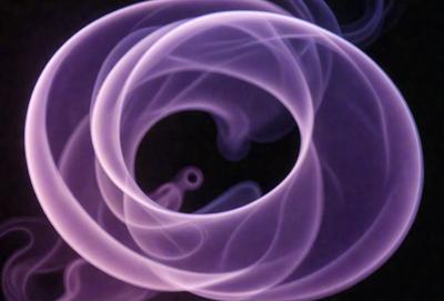 The primary subject of the image is a purple smoke ring, which is the main object, scene, or focus of the image. The setting or background is a dark background, which contrasts with the purple smoke ring. The visual style of the image is a digital art or illustration, as it is a purple smoke ring with a dark background. The colors and mood of the image are predominantly purple, creating a sense of mystery and intrigue.