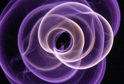 The primary subject of the image is a purple smoke ring, which is the main object, scene, or focus of the image. The setting or background is a dark background, which contrasts with the purple smoke ring. The visual style of the image is a digital art or illustration, as it is a purple smoke ring with a dark background. The colors and mood of the image are predominantly purple, creating a unique and artistic atmosphere.