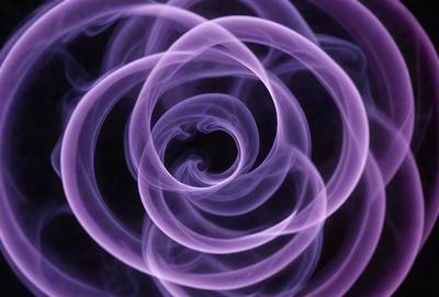 The primary subject of the image is a purple spiral, which appears to be a smoke or vapor pattern. The setting is a dark background, which contrasts with the purple spiral. The visual style is a combination of a photo and a digital art or illustration, as the spiral is created by a combination of smoke and vapor patterns. The colors and mood of the image are predominantly purple, giving it a somewhat mysterious and intriguing atmosphere.