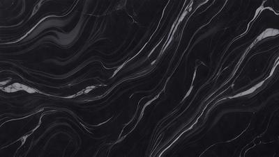 The primary subject of the image is a black marble countertop. The setting is a kitchen, with the countertop being the main focus of the scene. The visual style is a close-up of the marble countertop, showcasing its texture and pattern. The colors and mood of the image are predominantly dark, with the black marble countertop being the main source of contrast.