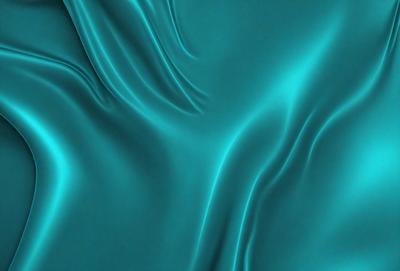 The primary subject of the image is a blue, flowing fabric that appears to be a piece of clothing or a curtain. The setting is a blue background, which complements the blue fabric. The visual style is a close-up of the fabric, showcasing its texture and flow. The colors and mood of the image are predominantly blue, creating a calm and serene atmosphere.