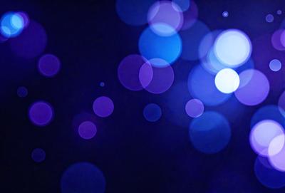 The primary subject of the image is a purple background with a pattern of blue lights. The setting appears to be a dark room, and the visual style is a combination of a photo and digital art. The dominant colors are purple and blue, creating a calm and serene atmosphere.