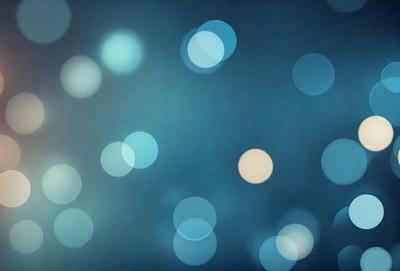 The primary subject of the image is a blue background with a pattern of white circles. The setting appears to be a dark room, and the visual style is a digital art or illustration. The dominant colors are blue and white, creating a calm and serene atmosphere.