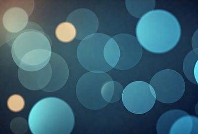 The primary subject of the image is a blue background with a pattern of white circles. The setting appears to be a dark room, and the visual style is a combination of a photo and digital art. The dominant colors are blue and white, creating a calm and serene atmosphere.