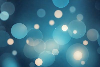 The primary subject of the image is a blue background with a pattern of white circles. The setting appears to be a dark room, as the circles are the main focus of the image. The visual style is a combination of a photo and digital art, creating a unique and interesting pattern. The dominant colors are blue and white, giving the image a calm and serene atmosphere.