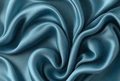 The primary subject of the image is a blue fabric, which appears to be a piece of silk. The setting is a close-up of the fabric, showcasing its texture and intricate patterns. The visual style is a detailed illustration or drawing of the fabric, capturing its unique features. The colors and mood of the image are predominantly blue, creating a calm and serene atmosphere.