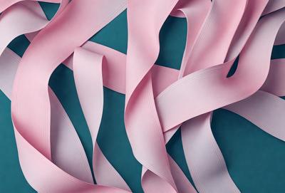 The primary subject of the image is a close-up of a pink ribbon. The ribbon is woven and appears to be made of fabric. The setting is a blue background, which provides a contrasting color to the pink ribbon. The visual style of the image is a close-up, focusing on the details of the ribbon. The colors and mood of the image are predominantly pink, creating a warm and inviting atmosphere.