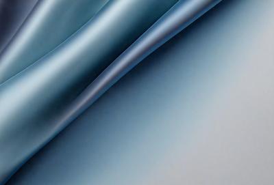 The primary subject of the image is a blue and white striped fabric. The setting is a white background, which provides a clean and minimalist appearance. The visual style is a close-up of the fabric, showcasing its texture and pattern. The colors and mood of the image are predominantly blue and white, creating a calm and serene atmosphere.