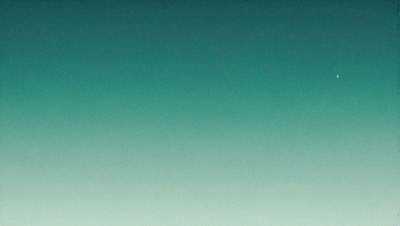 The primary subject of the image is a large, open sky with a deep blue color. The setting is a vast, empty space with no visible landmarks or objects. The visual style of the image is a natural, outdoor scene with a serene and peaceful atmosphere. The colors and mood convey a sense of tranquility and freedom.