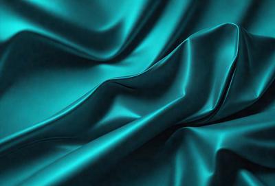 The primary subject of the image is a blue fabric, which is the main object, scene, or focus of the image. The setting or background is a dark blue surface, and the visual style is a photo. The dominant colors and overall atmosphere are dark blue and purple, creating a moody and dramatic effect.