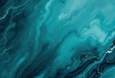 The primary subject of the image is a large body of water, possibly an ocean or a large lake. The water appears to be blue and has a swirling pattern, giving it a dynamic and visually appealing appearance. The setting is a vast expanse of water, with no visible land or other objects in the background. The visual style of the image is a close-up of the water, emphasizing its swirling pattern and the blue color. The overall atmosphere of the image is serene and calming, with the vast