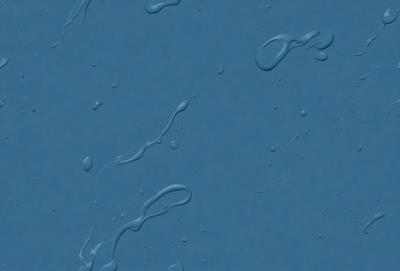 The primary subject of the image is a blue surface with droplets of water on it. The setting is a dark blue background, and the visual style appears to be a photo. The colors and mood of the image are predominantly dark and moody, with the blue surface and water droplets creating a sense of depth and intrigue.