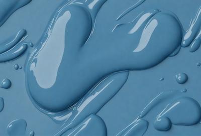The primary subject of the image is a blue liquid, possibly water or a blue substance, with a heart shape. The setting is a blue surface, possibly a table or a wall, with the blue liquid spreading across it. The visual style appears to be a digital art or illustration, as the heart shape and the blue liquid are depicted in a creative and artistic manner. The colors and mood of the image are predominantly blue, giving it a calm and serene atmosphere.