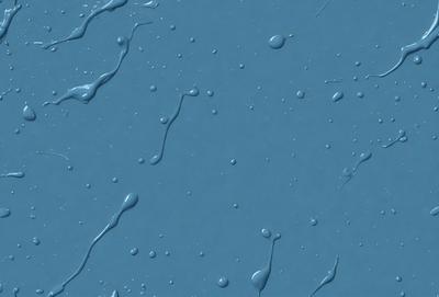 The primary subject of the image is a blue surface with droplets of water on it. The setting is a dark blue background, and the visual style appears to be a photo. The colors and mood of the image are predominantly dark and moody, with the blue surface and water droplets creating a sense of depth and intrigue.