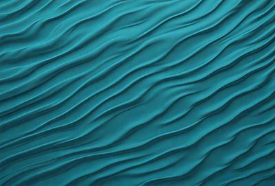 The primary subject of the image is a blue, rippled surface, which appears to be a wall or a piece of artwork. The setting is a room with a blue background, and the visual style is a close-up of the blue surface. The colors and mood of the image are predominantly blue, creating a calm and serene atmosphere.