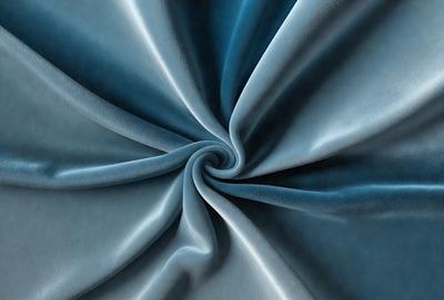 The primary subject of the image is a blue fabric, possibly a piece of cloth or a curtain. The setting is a room with a blue background, which creates a cohesive and visually appealing environment. The visual style of the image is a close-up of the blue fabric, showcasing its texture and details. The colors and mood of the image are predominantly blue, giving it a calm and serene atmosphere.