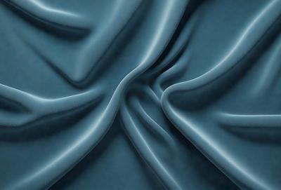 The primary subject of the image is a blue fabric, which appears to be a piece of cloth or a curtain. The setting is a room with a blue background, which complements the blue fabric. The visual style is a close-up of the fabric, showcasing its texture and details. The colors and mood of the image are predominantly blue, creating a calm and serene atmosphere.