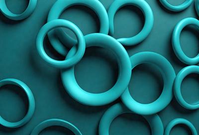 The primary subject of the image is a collection of blue rings, which are arranged in a visually appealing manner. The setting is a blue background, which complements the color of the rings. The visual style of the image is a close-up of the rings, showcasing their unique shapes and textures. The dominant colors in the image are blue, which creates a calm and soothing atmosphere.