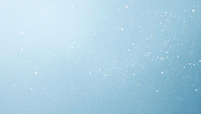 The primary subject of the image is a blue sky filled with white snowflakes. The setting is a clear, cloudless day, and the visual style is a natural, outdoor scene. The colors and mood of the image are predominantly blue and serene, creating a peaceful and tranquil atmosphere.