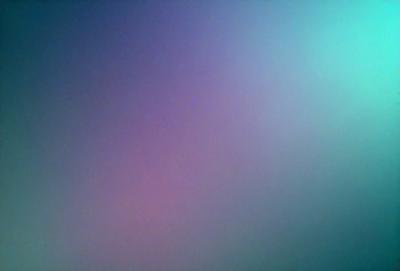 The primary subject of the image is a purple and blue background. The setting is a dark, cloudy sky, which creates a moody atmosphere. The visual style is a close-up of the background, showcasing the vibrant colors and textures. The colors and mood of the image are predominantly purple and blue, with a hint of darkness, giving it a serene and calming feel.