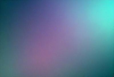 The primary subject of the image is a purple background. The setting is a dark, purple-colored room. The visual style is a close-up of the purple background, which creates a moody and atmospheric mood.