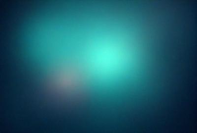 The primary subject of the image is a green, glowing light. The setting is a dark, blue background, which contrasts with the bright green light. The visual style appears to be a digital art or illustration, as the light seems to be a part of a larger design or pattern. The colors and mood of the image are predominantly dark and moody, with the green light providing a contrasting and luminous element.