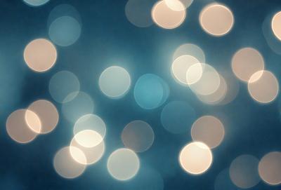 The primary subject of the image is a blue background with a pattern of white lights. The setting appears to be a dark room, and the visual style is a digital art or illustration. The dominant colors are blue and white, creating a calm and serene atmosphere.