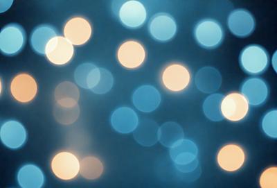 The primary subject of the image is a blue background with a pattern of white lights. The setting appears to be a dark room, and the visual style is a digital art or illustration. The dominant colors are blue and white, creating a calm and serene atmosphere.