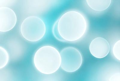 The primary subject of the image is a group of white, round, glowing orbs floating in a blue, light-filled space. The setting appears to be a futuristic or surreal environment, with the orbs seemingly floating in the air. The visual style of the image is a combination of digital art and illustration, creating a unique and captivating scene. The dominant colors in the image are white and blue, giving the orbs a bright and luminous appearance. The overall atmosphere of the image is one